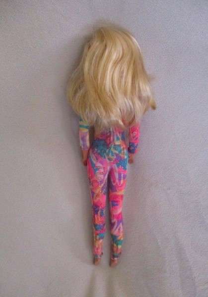 A Vintage 1980's Mattel Barbie doll with knees that bend in pretty jumpsuit