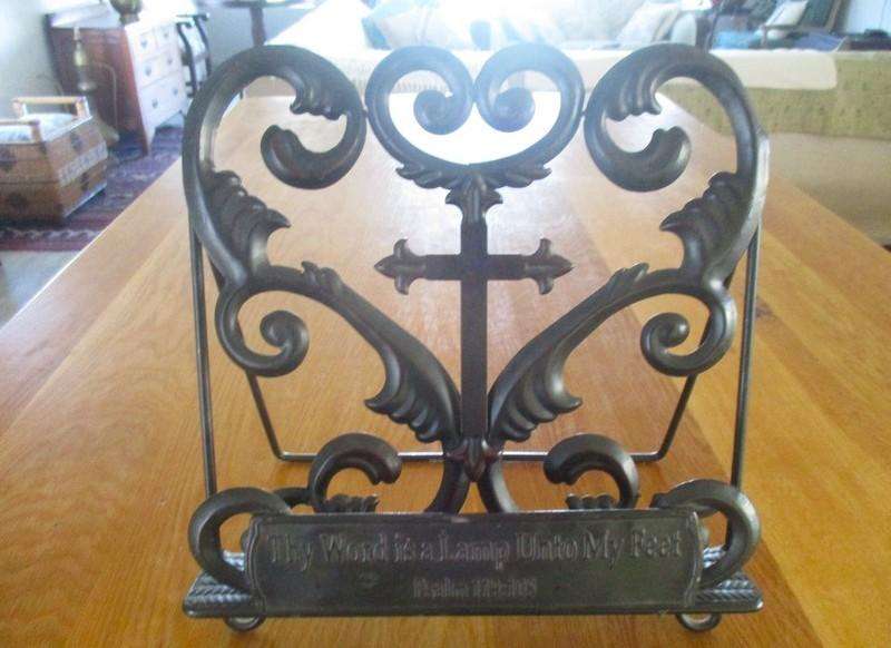 A beautiful ornate metal Bible/book stand with Fleurs-de-lis Cross