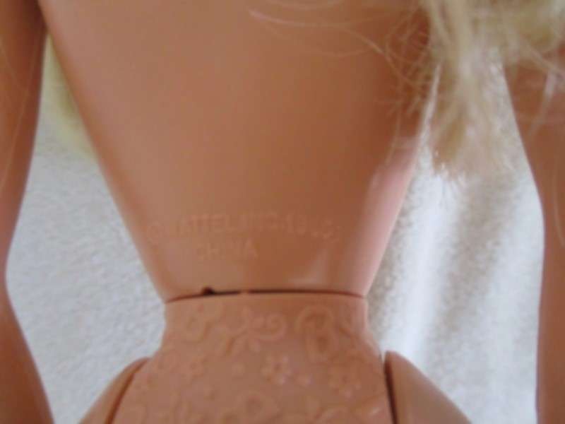 A Vintage 1980's Mattel Barbie doll with knees that bend in pretty jumpsuit