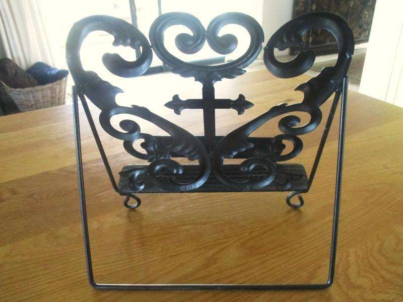 A beautiful ornate metal Bible/book stand with Fleurs-de-lis Cross