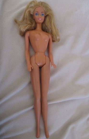 Vintage Mattel Barbie doll in swimsuit and skirt -  Knees bend