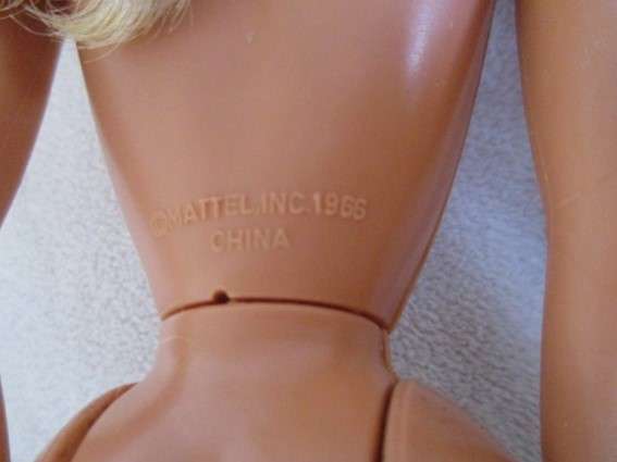 Vintage Mattel Barbie doll in swimsuit and skirt -  Knees bend