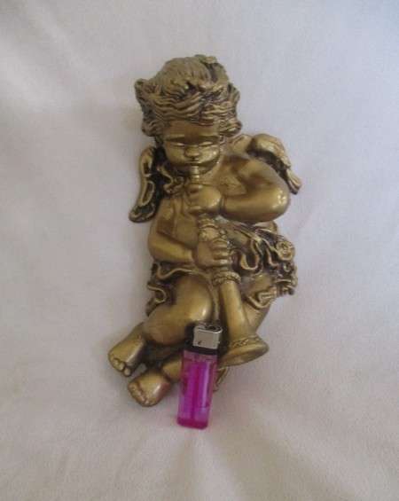 A cute larger size cherub wall plaque - cherub blowing trumpet