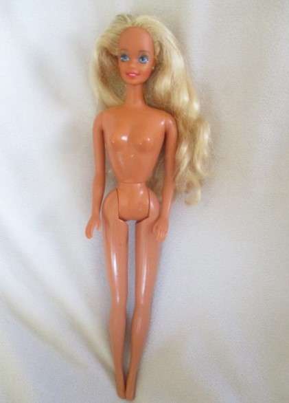 A Mattel Barbie doll with tinsel in her hair - 1991 Sun Sensation Barbie? -  Knees bend