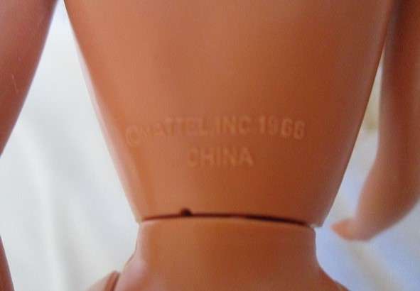 A Mattel Barbie doll with tinsel in her hair - 1991 Sun Sensation Barbie? -  Knees bend