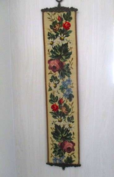 Well made vintage tapestry wall hanging with roses and flowers and ornate metal top and bottom frame