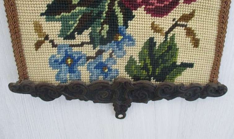 Well made vintage tapestry wall hanging with roses and flowers and ornate metal top and bottom frame