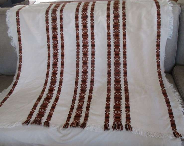 A large, quality throw with embroidered geometric design - in great condition