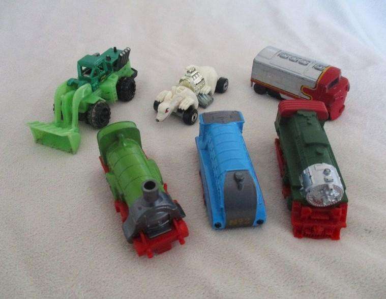 A batch of six small Die Casts - four New-Ray locomotives plus Hot Wheels Ratmobile and Wheel Loader