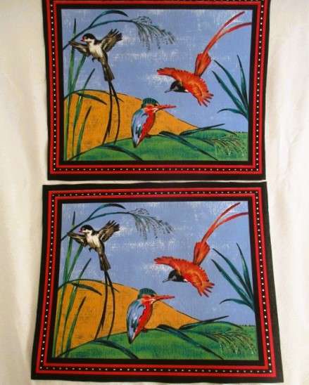Ten material placemats with colourful bird designs