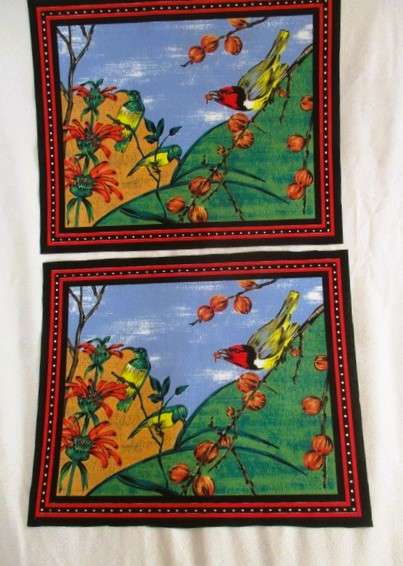 Ten material placemats with colourful bird designs