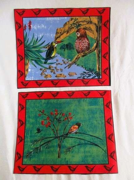 Ten material placemats with colourful bird designs