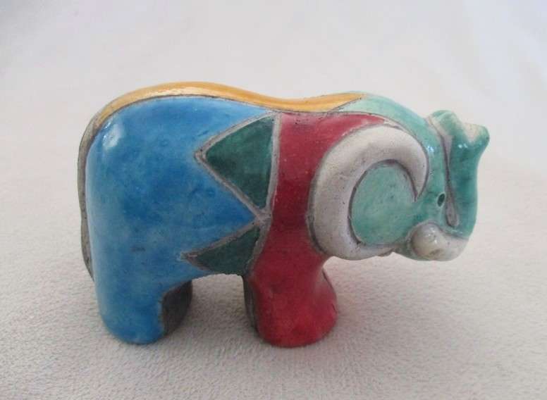 A small Raku elephant -signed by artist - great condition