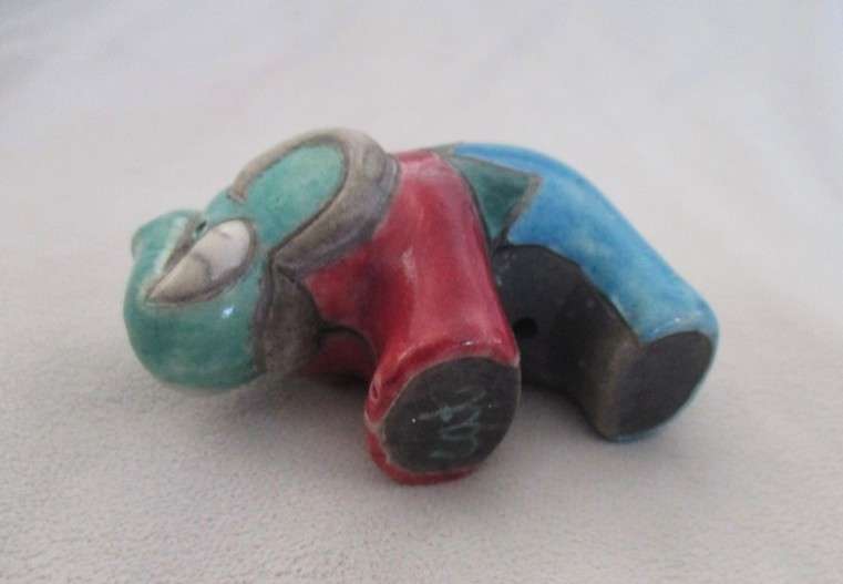 A small Raku elephant -signed by artist - great condition