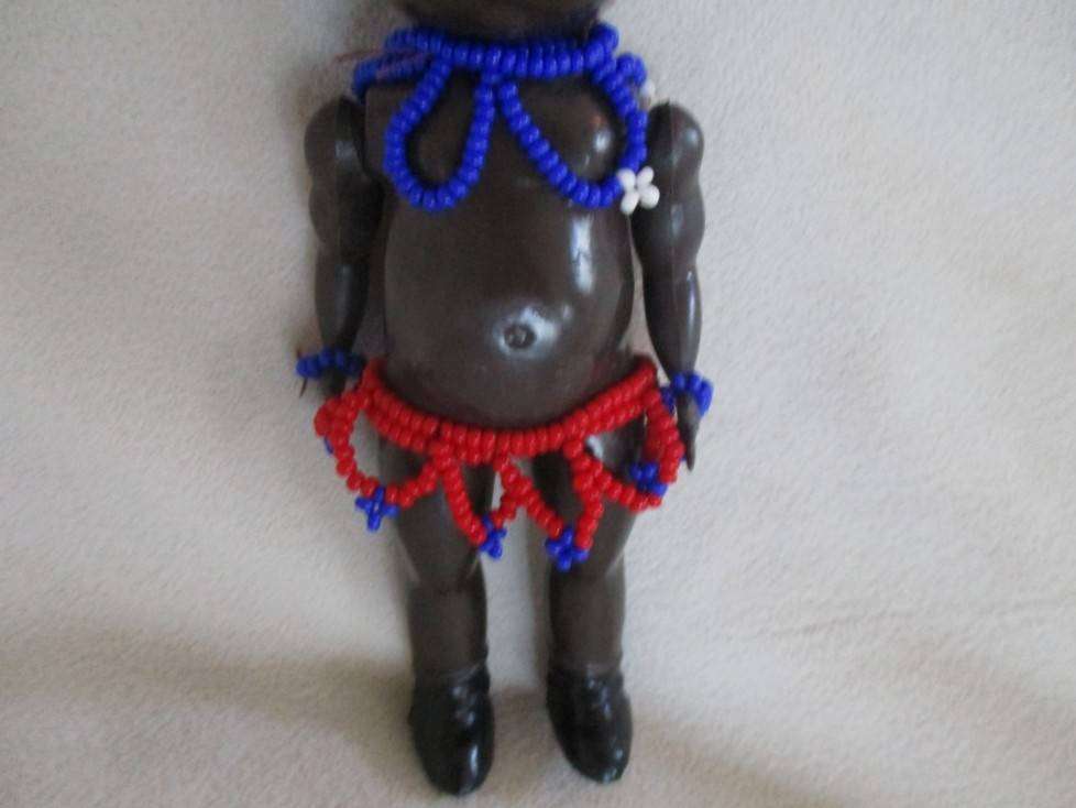 Two small vintage African black dolls (larger marked Hong Kong)