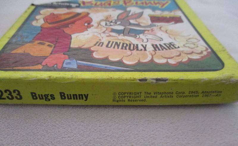 Two vintage Cartoon 8mm film reels in original boxes - Bugs Bunny and Woody Woodpecker