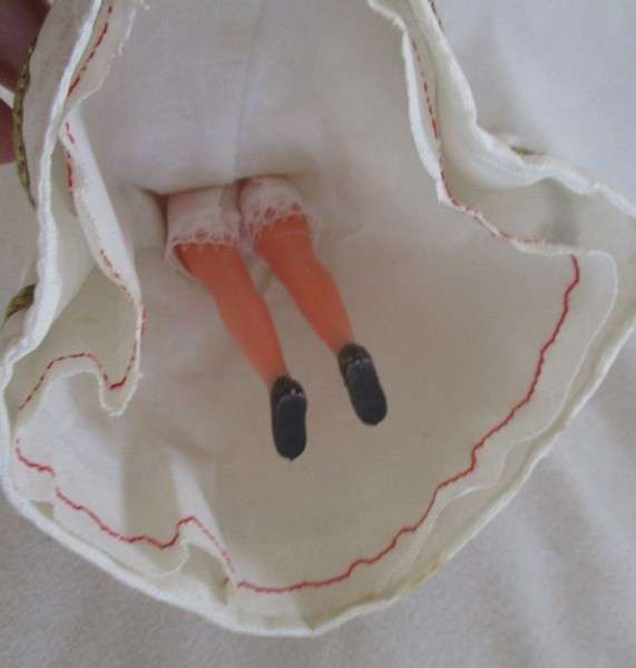 Small vintage doll in religious garb