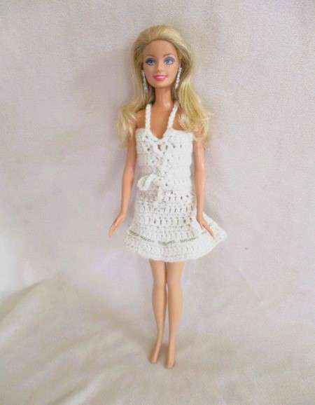 A very pretty Mattel Barbie with original earrings and knees that bend - lovely "fur" lined coat
