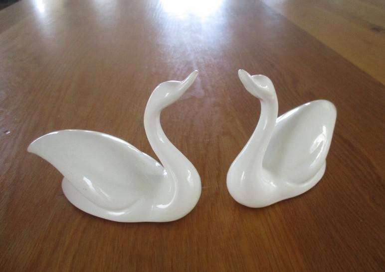 Two elegant white porcelain swans