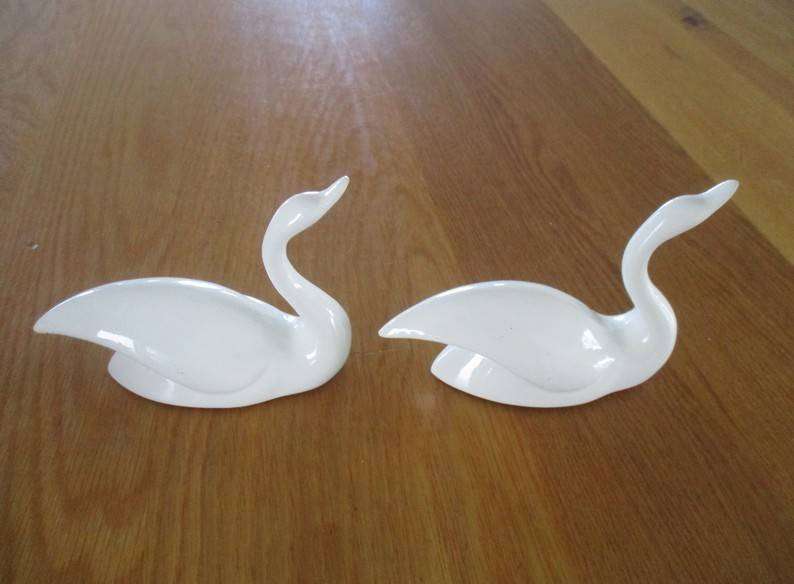 Two elegant white porcelain swans