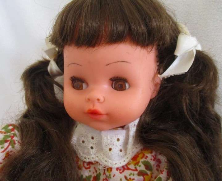 A cute pert-faced vintage doll