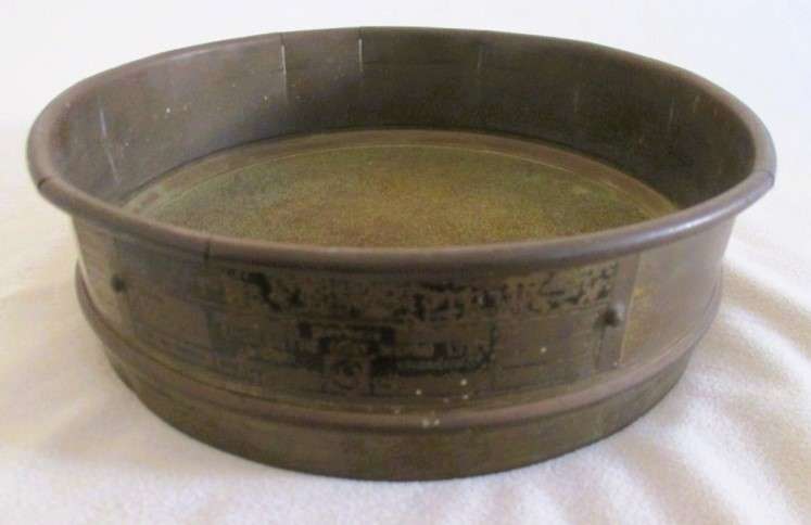 A very old antique gold panning sieve made in England