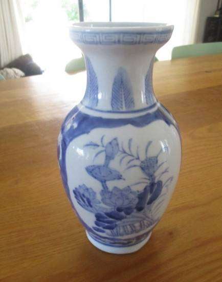 Nice sized blue and white Chinese vase with bird and blossom design