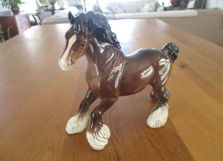 A large vintage porcelain cart horse