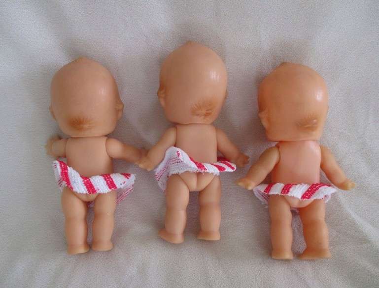 Three adorable small kewpie dolls -Triplets!