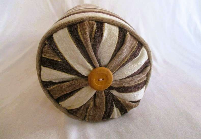 A very well made long, round cushion