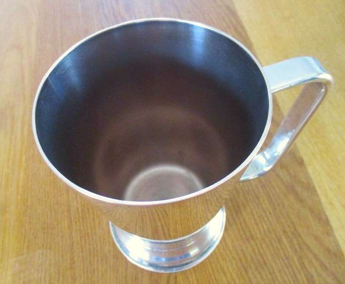 Unusual antique JC & CO silver plated goblet with crossed rifles plus vintage silver plated tankard