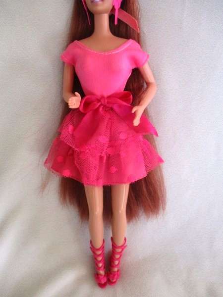 A Mattel Barbie with gorgeous EXTRA long red hair with original earrings - knees bend