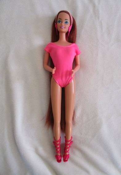 A Mattel Barbie with gorgeous EXTRA long red hair with original earrings - knees bend
