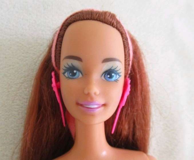 A Mattel Barbie with gorgeous EXTRA long red hair with original earrings - knees bend