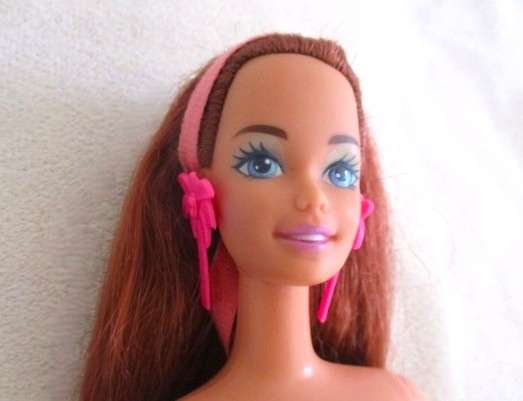 A Mattel Barbie with gorgeous EXTRA long red hair with original earrings - knees bend