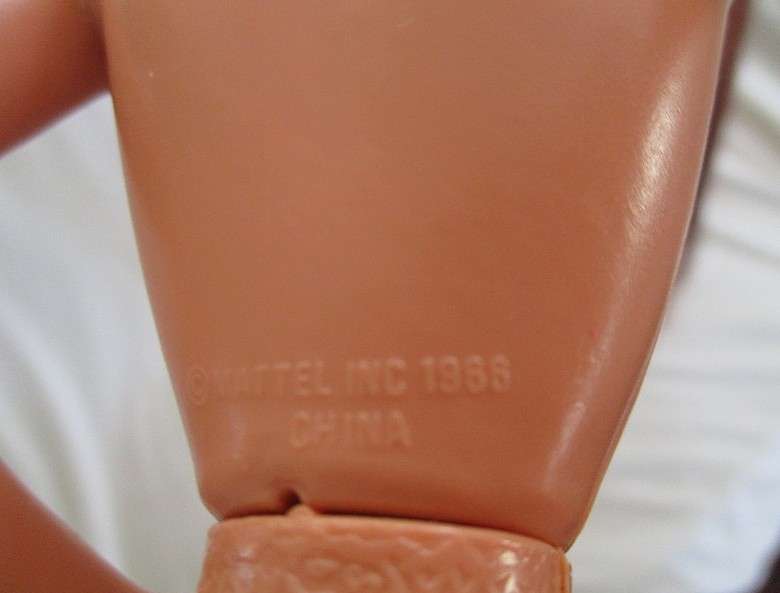 A Mattel Barbie with gorgeous EXTRA long red hair with original earrings - knees bend