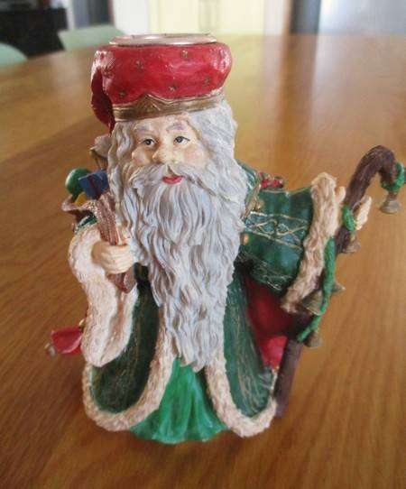 Christmas is coming!  Two Santa candlesticks plus Nativity scene