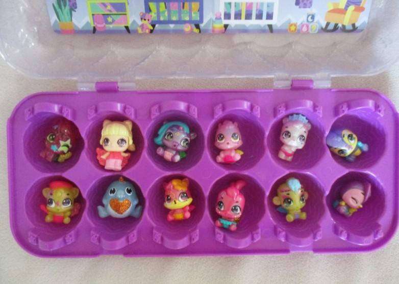 A plastic egg carton containing twelve Hatchimals CollEGGtibles