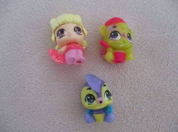 A plastic egg carton containing twelve Hatchimals CollEGGtibles