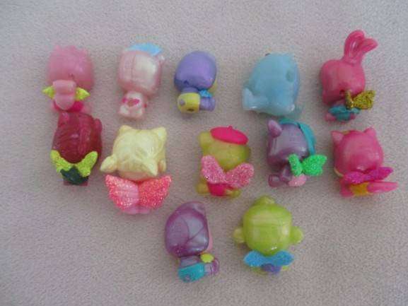 A plastic egg carton containing twelve Hatchimals CollEGGtibles