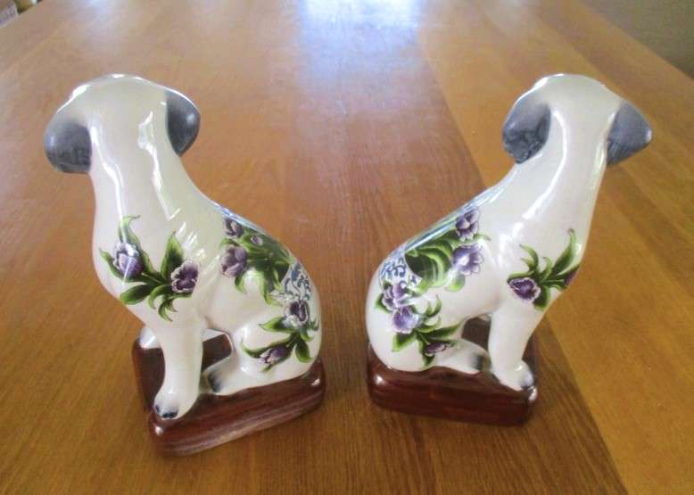 Two  hand painted porcelain dogs with decorative floral design - great bookends!