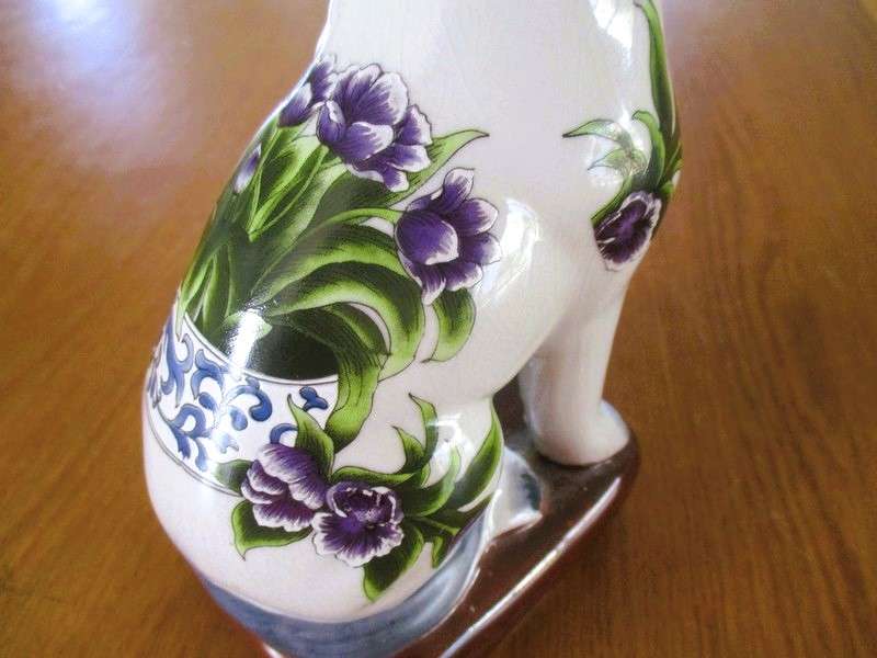 Two  hand painted porcelain dogs with decorative floral design - great bookends!