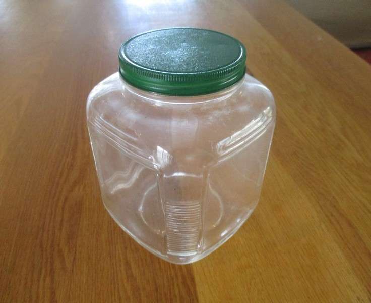 Two large old pickle/chutney jars with metal lids- handy in the kitchen pantry!