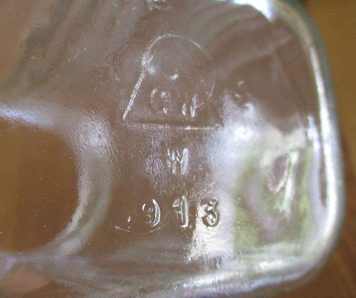 Two large old pickle/chutney jars with metal lids- handy in the kitchen pantry!