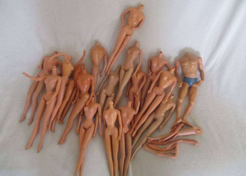 For the Barbie remodeller/custom builder -a whole box of incomplete Barbies and spare parts
