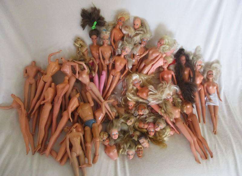 For the Barbie remodeller/custom builder -a whole box of incomplete Barbies and spare parts