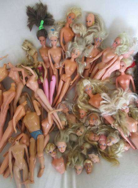 For the Barbie remodeller/custom builder -a whole box of incomplete Barbies and spare parts