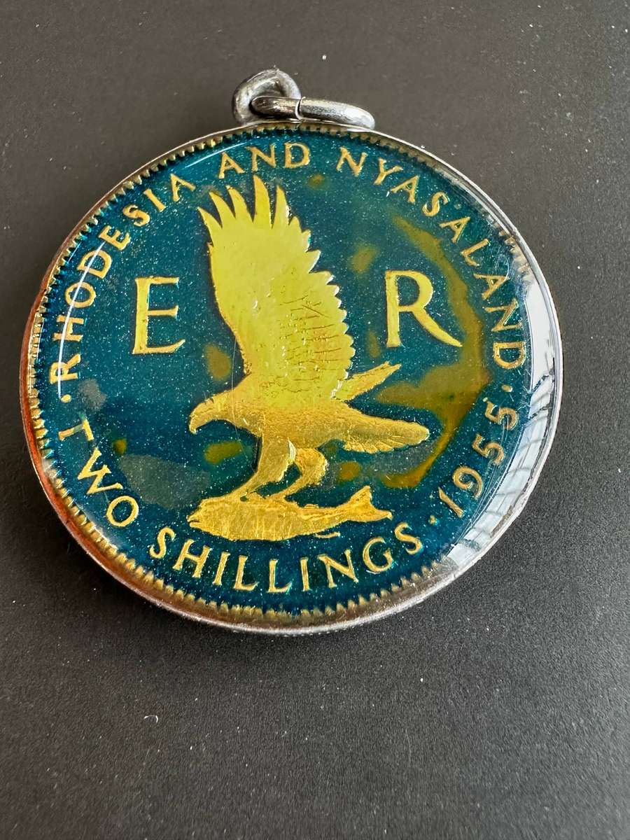 Rhodesia & Nyasaland enamelled two shillings 1955