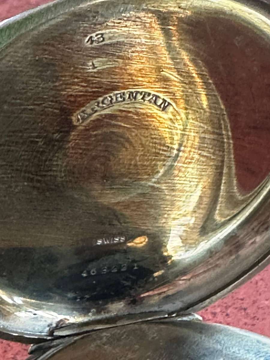 A Brevet 8 Day Goliath pocket watch in .800 silver stand
