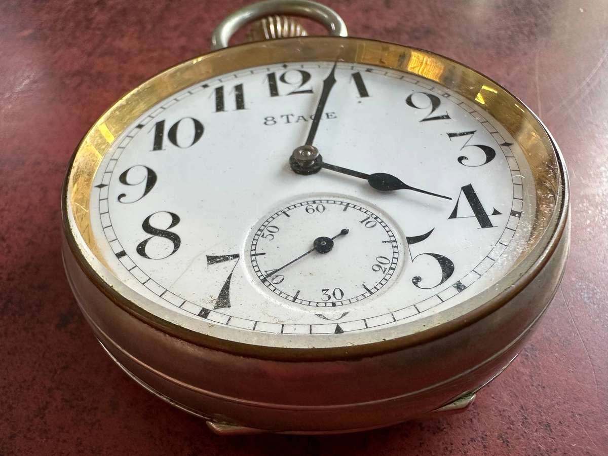 A Brevet 8 Day Goliath pocket watch in .800 silver stand